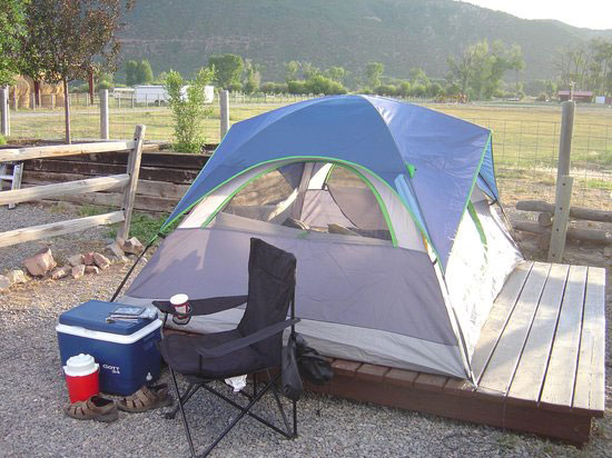 Travellers relaxing in hot springs with RV camping.
